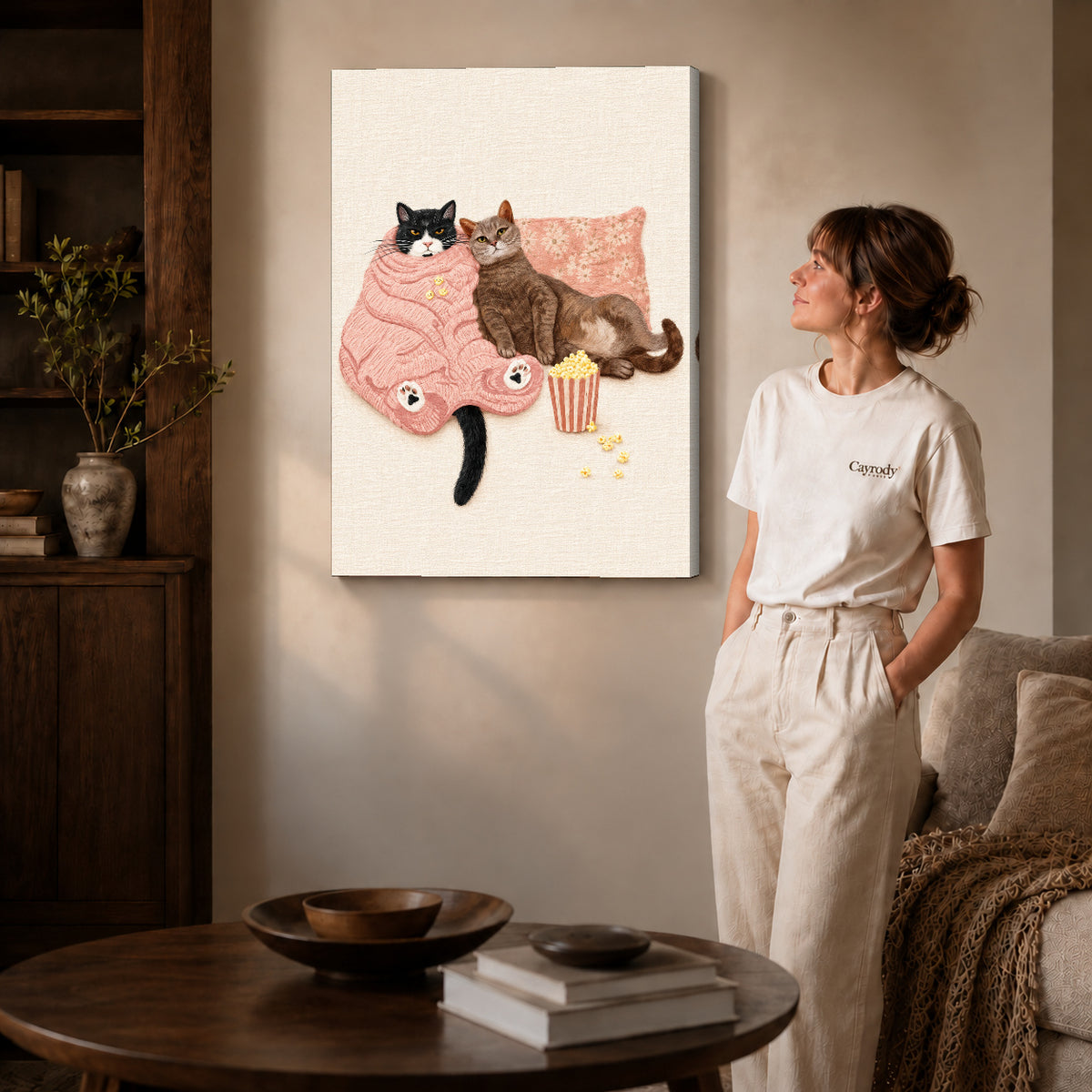 Cozy Movie Cats canvas art displayed as gallery wrapped canvas beside a woman in natural light.