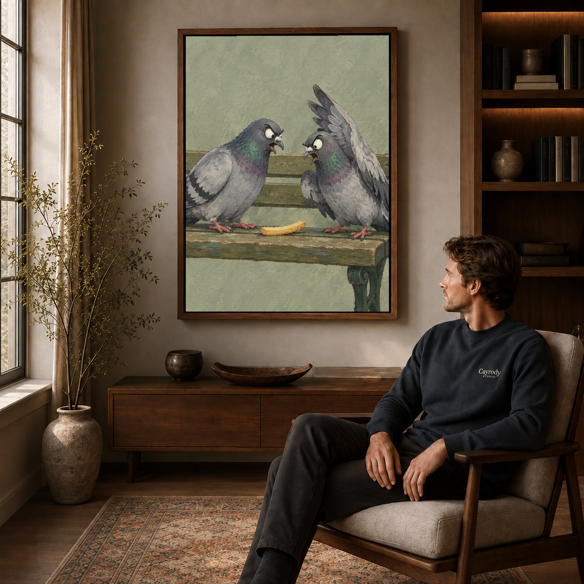 Snack Pigeons canvas art above a wooden console beside a seated man in a warm room.