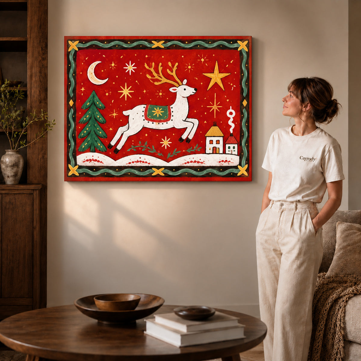 Festive Folk Reindeer canvas art displayed as gallery wrapped canvas beside a woman in natural light.