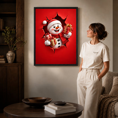 Gift Giving Snowman canvas art in a black frame above books in a welcoming living room.