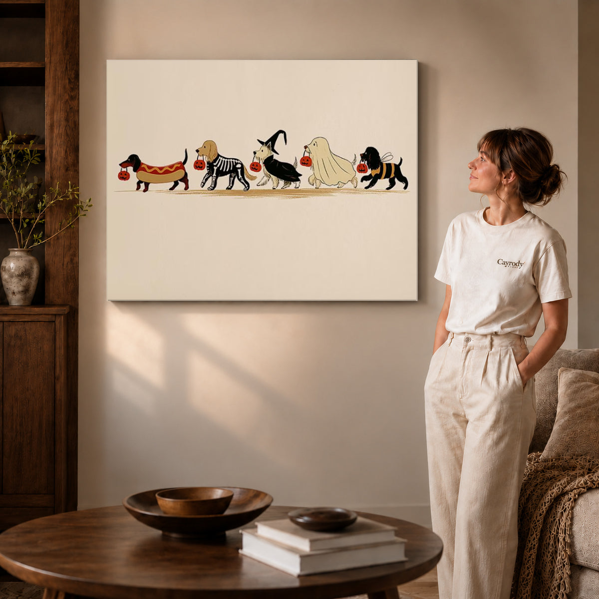 Costumed Dog Parade canvas art displayed as gallery wrapped canvas beside a woman in natural light.