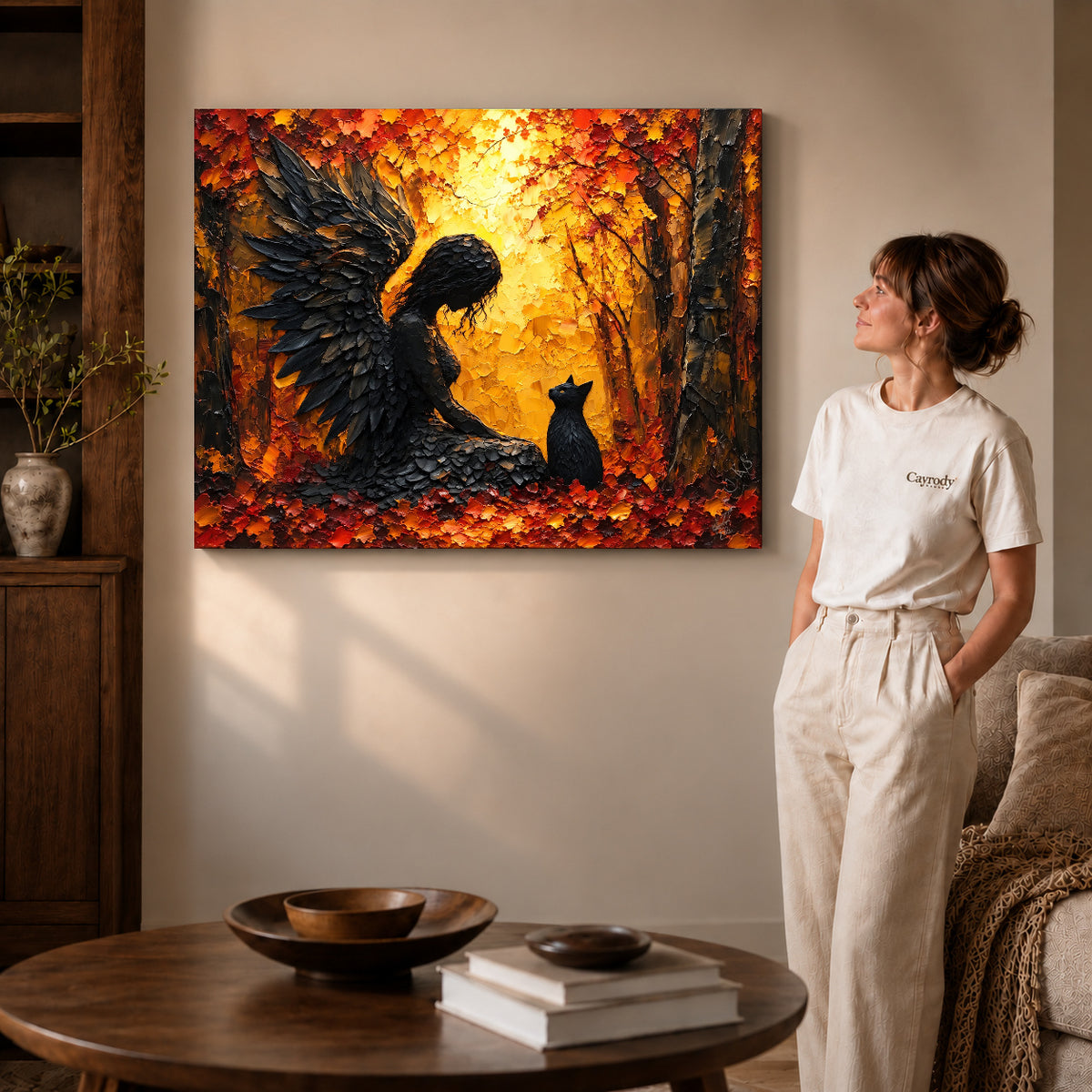Gallery wrapped feathered guardian cat canvas art with visible canvas edges beside a standing woman.