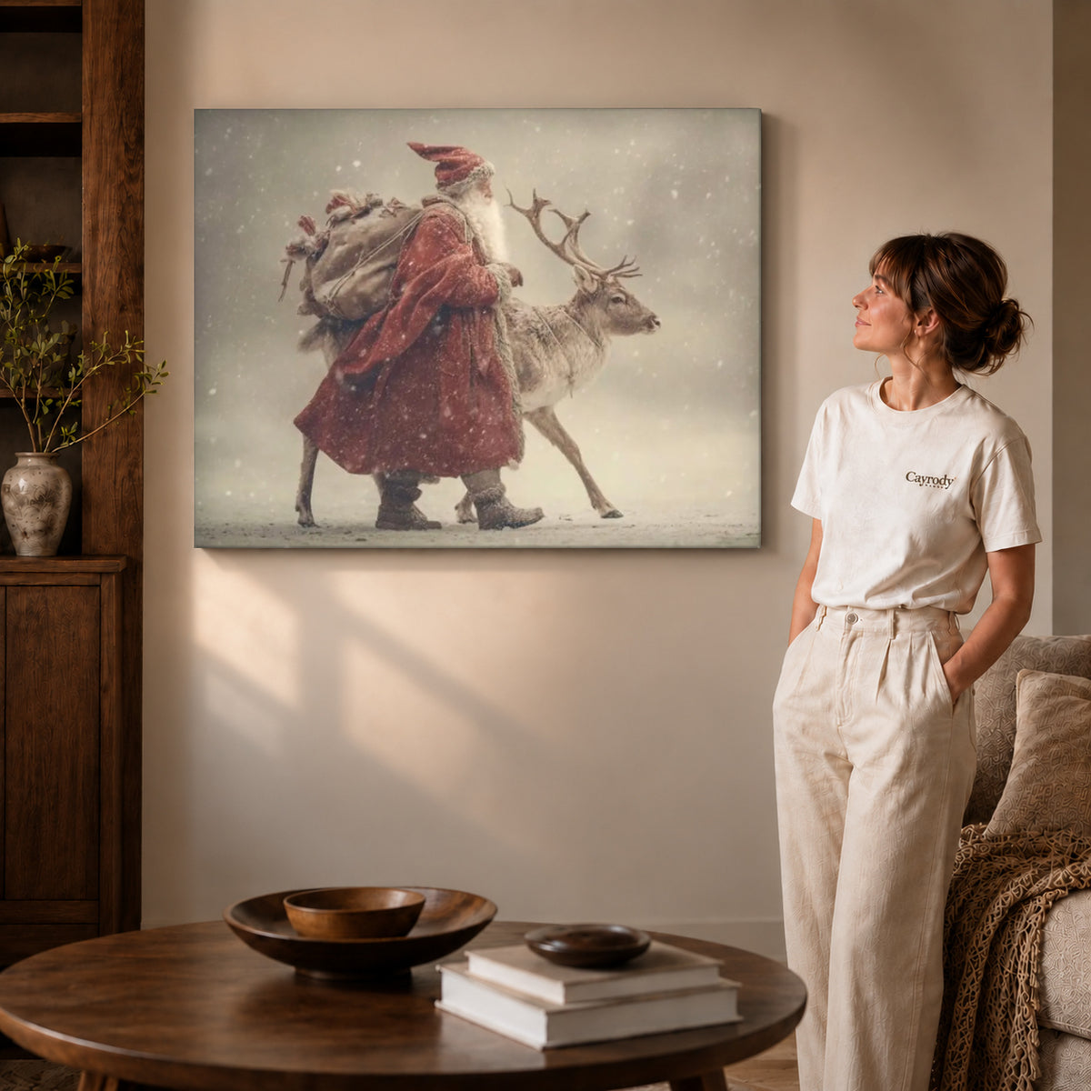 Santa Reindeer canvas art displayed as gallery wrapped canvas beside a woman in natural light.