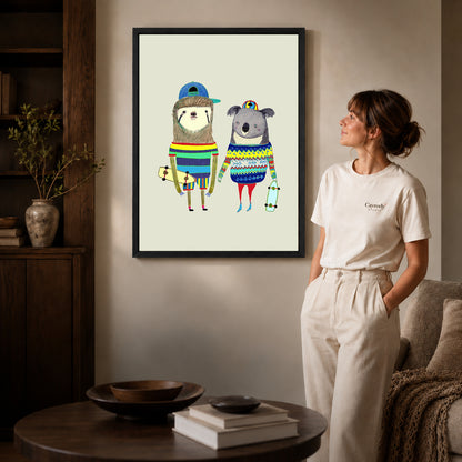 Black framed skateboard friends canvas art displayed beside a woman in a warm living room.