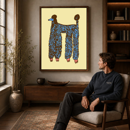 Blue Poodle canvas art above a wooden console beside a seated man in a warm room.