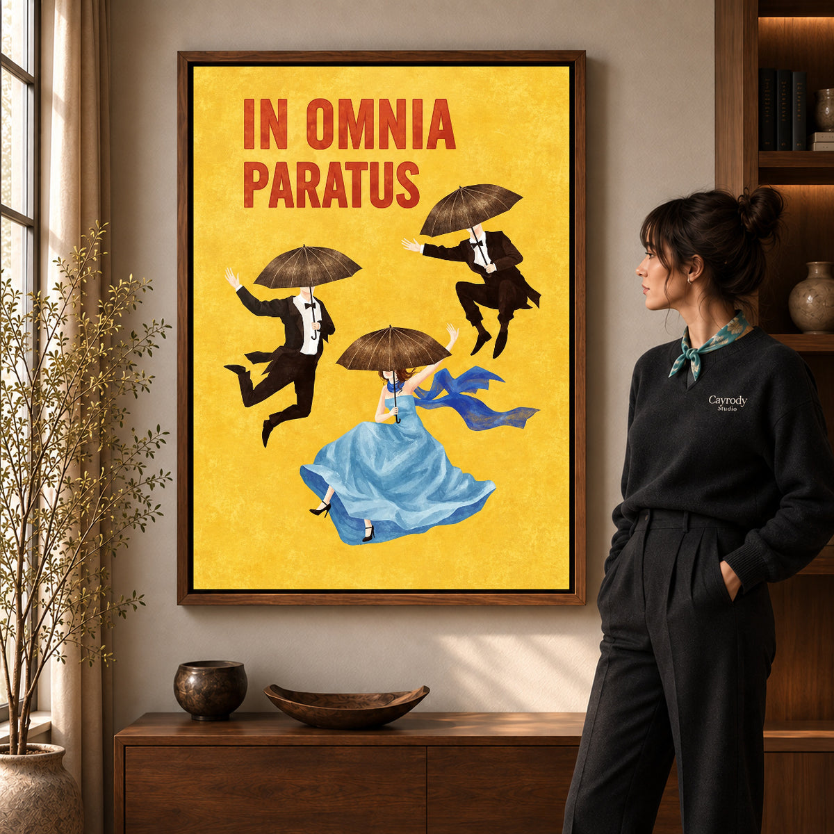 Umbrella Dreamers canvas art in a walnut frame beside a standing woman and wooden console.