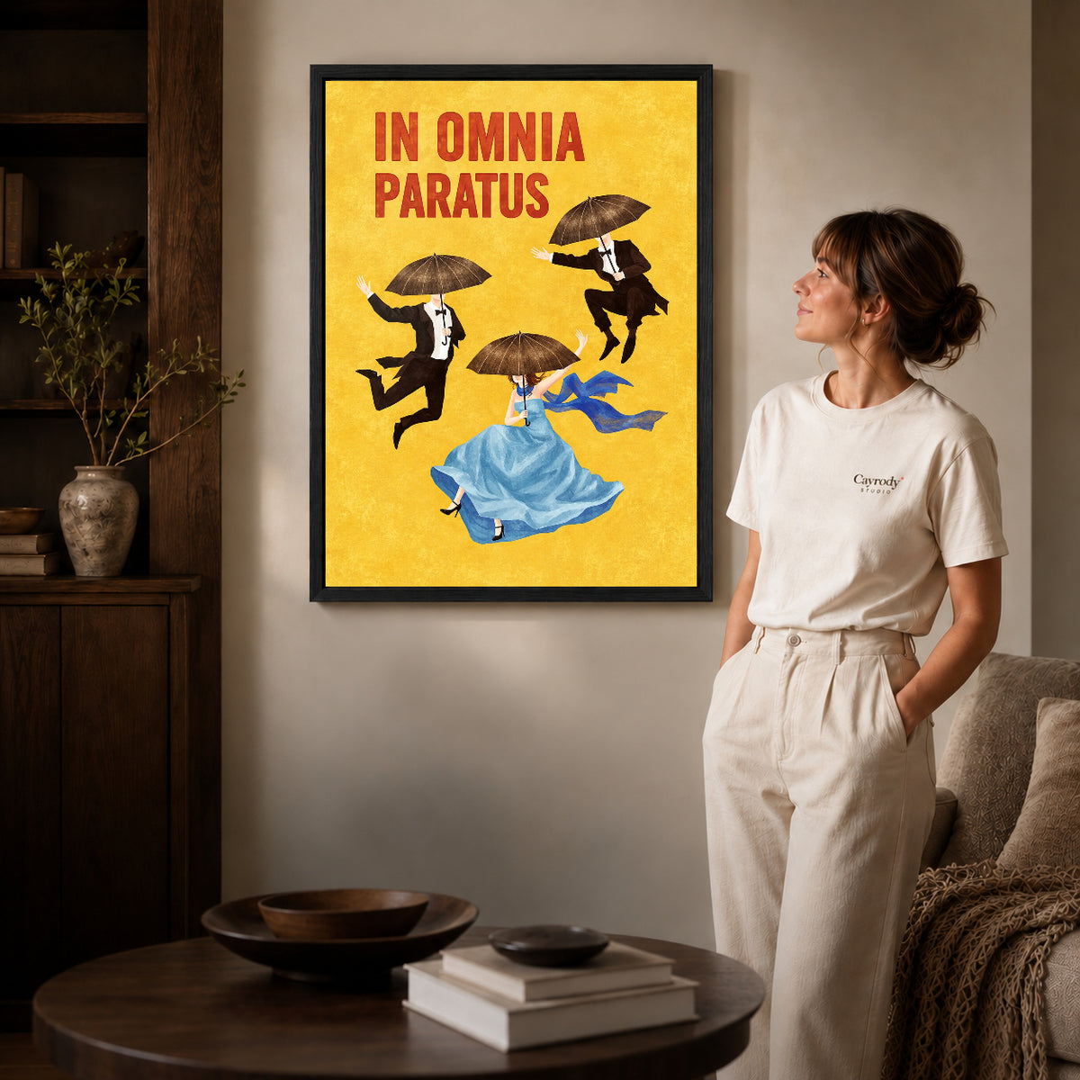 Black framed umbrella dreamers canvas art displayed beside a woman in a warm living room.
