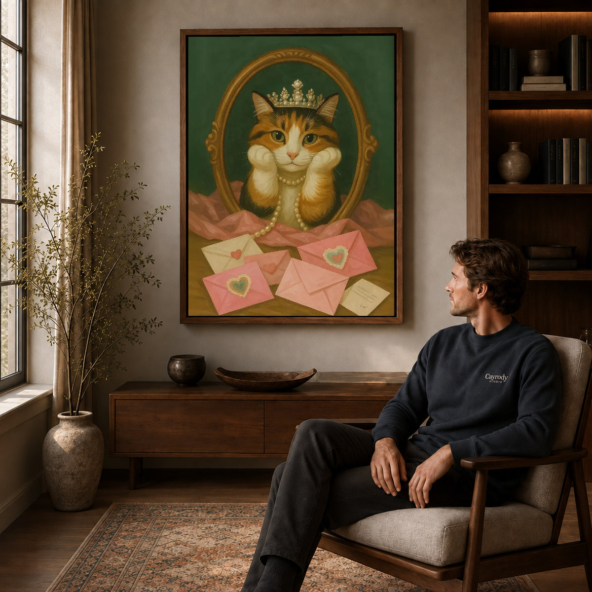 Royal Cat canvas art above a wooden console beside a seated man in a warm room.