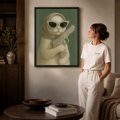 Glamorous Cat canvas art in a black frame above books in a welcoming living room.