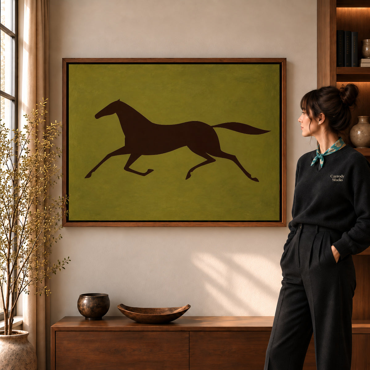 Walnut framed galloping horse canvas art shown beside a standing woman and a wooden console.
