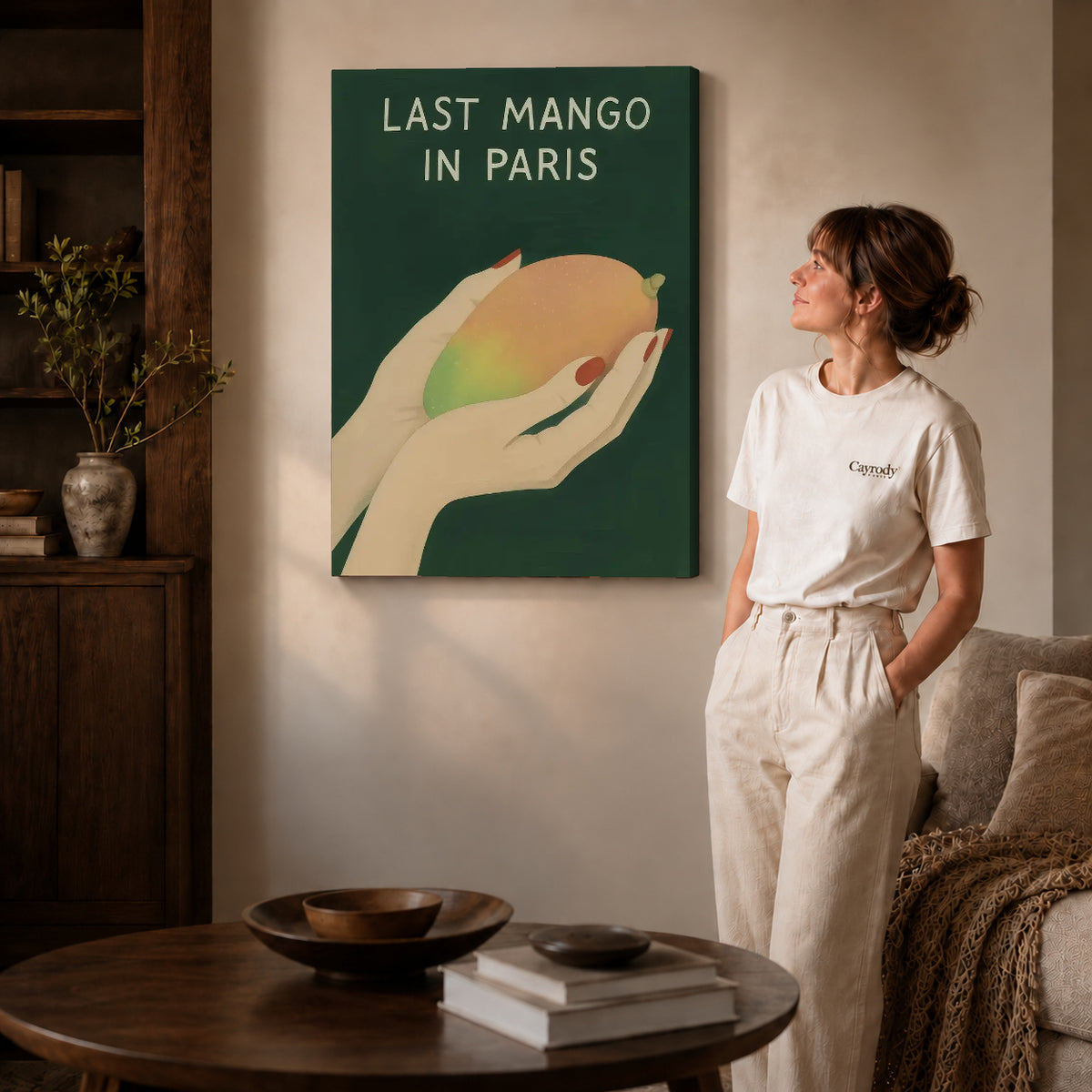 Last Mango canvas art displayed as gallery wrapped canvas beside a woman in natural light.