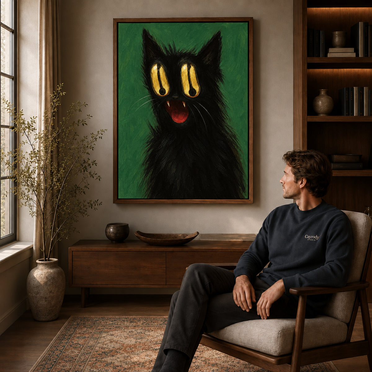 Golden Eyed Cat canvas art above a wooden console beside a seated man in a warm room.