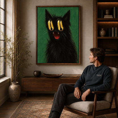 Golden Eyed Cat canvas art above a wooden console beside a seated man in a warm room.