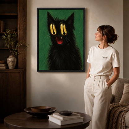 Black framed golden eyed cat canvas art displayed beside a woman in a warm living room.