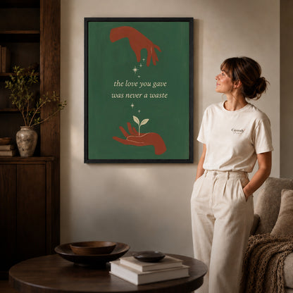 Growing Love canvas art in a black frame above books in a welcoming living room.