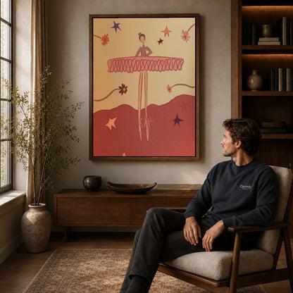 Playful Ballerina canvas art above a wooden console beside a seated man in a warm room.