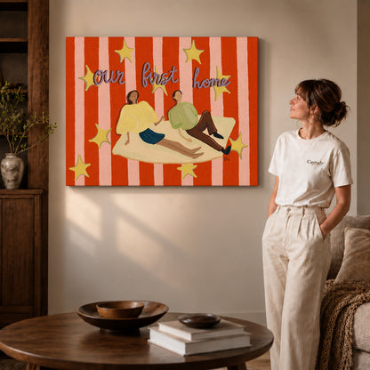 Gallery wrapped first home couple canvas art with visible canvas edges beside a standing woman.