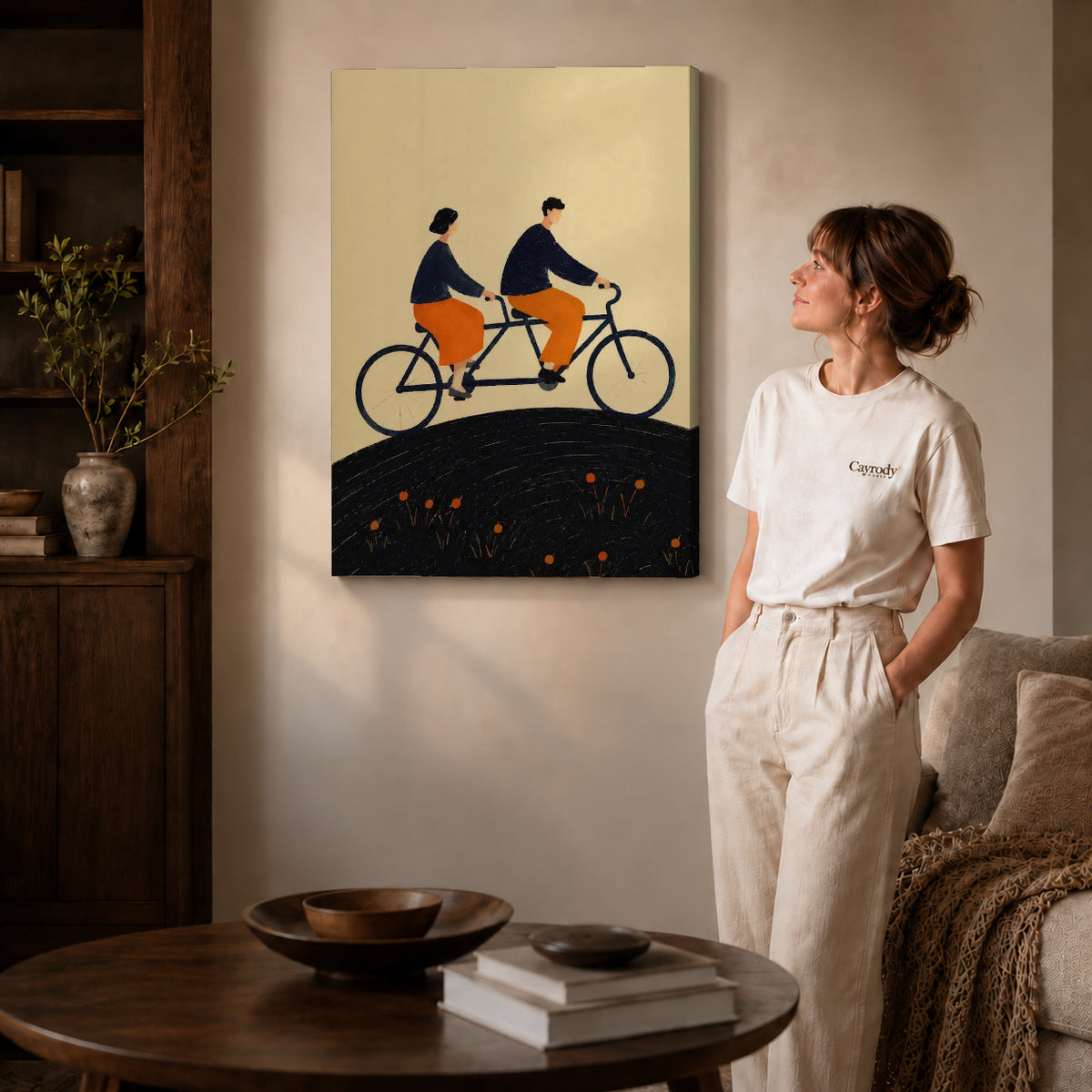 Tandem Ride canvas art displayed as gallery wrapped canvas beside a woman in natural light.