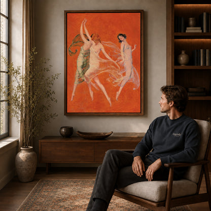 Graceful Dancers canvas art above a wooden console beside a seated man in a warm room.