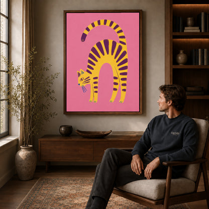 Arched Tabby canvas art above a wooden console beside a seated man in a warm room.