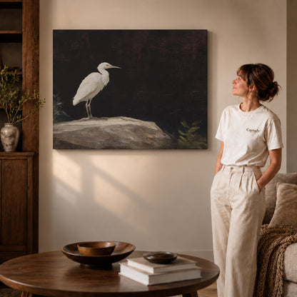 Quiet Egret canvas art displayed as gallery wrapped canvas beside a woman in natural light.