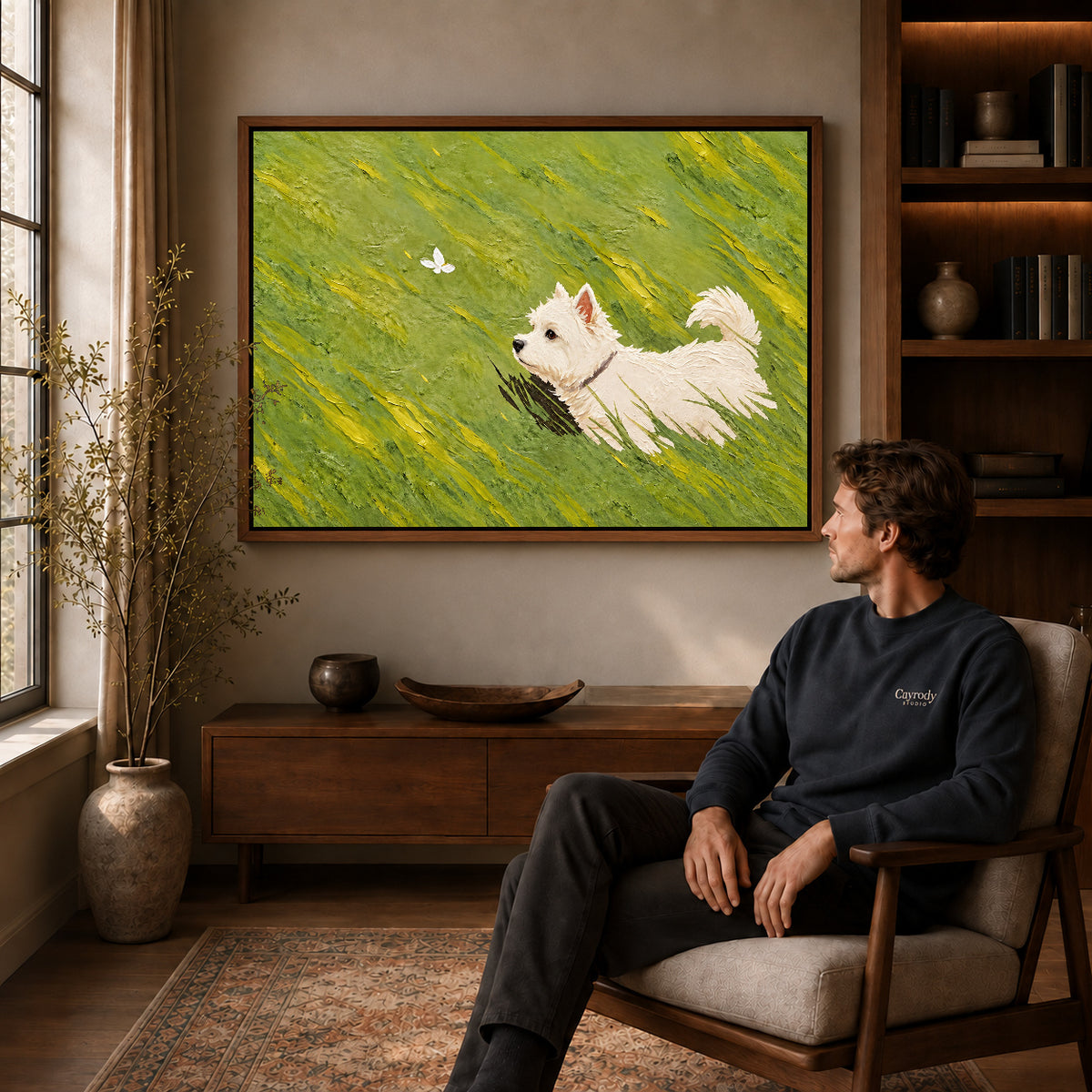 Westie Canvas Art displayed in a walnut frame above wooden furniture beside a seated man.