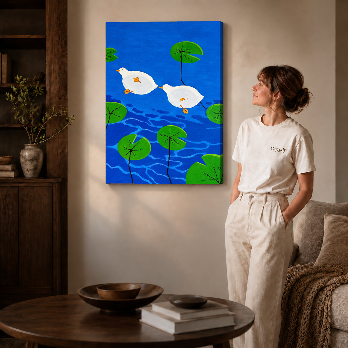 Duck Canvas Art on gallery wrapped canvas with visible depth beside a woman in white.