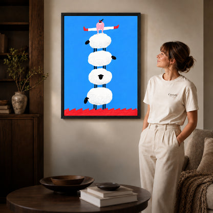 Black framed sheep canvas art displayed beside a woman with natural light across the wall.