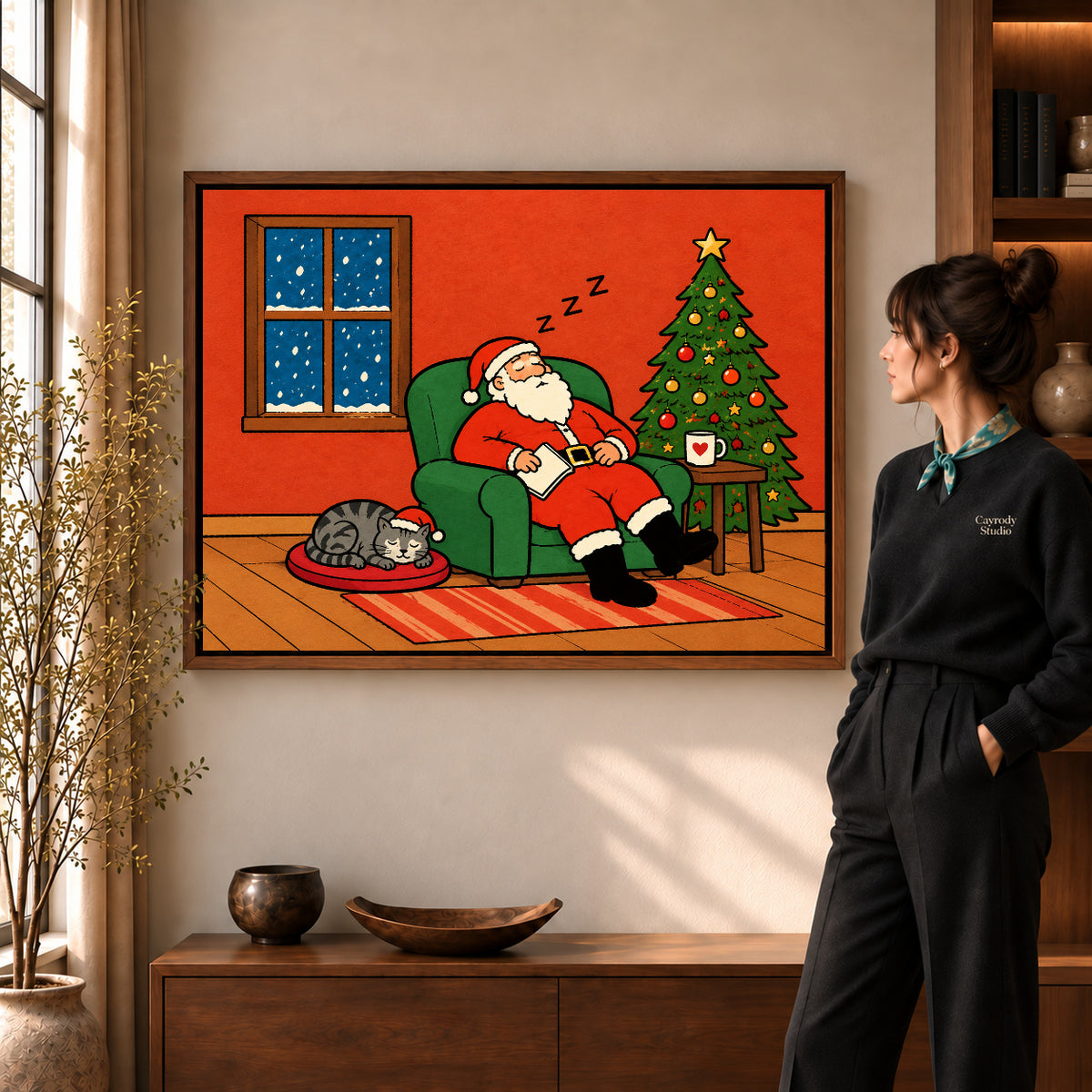 Santa Canvas Art in a walnut frame beside a standing woman and warm wooden furniture.