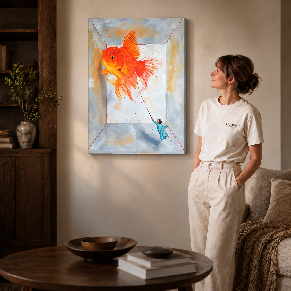 Goldfish Canvas Art on gallery wrapped canvas with visible depth beside a woman in white.