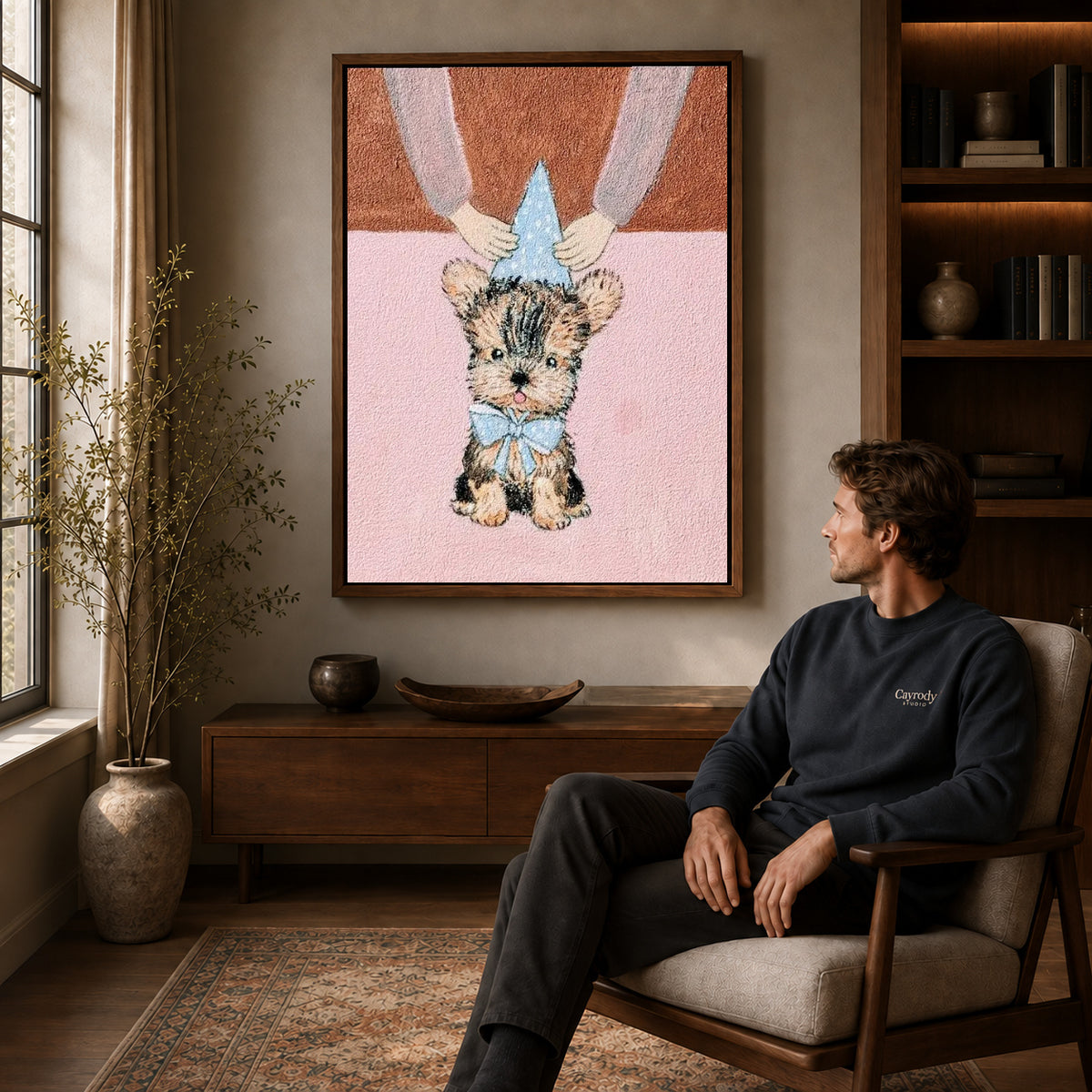 Birthday Puppy Canvas Art displayed in a walnut frame above wooden furniture beside a seated man.