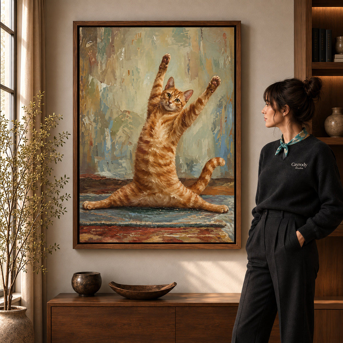 Funny Cat Canvas Art in a walnut frame beside a standing woman and warm wooden furniture.