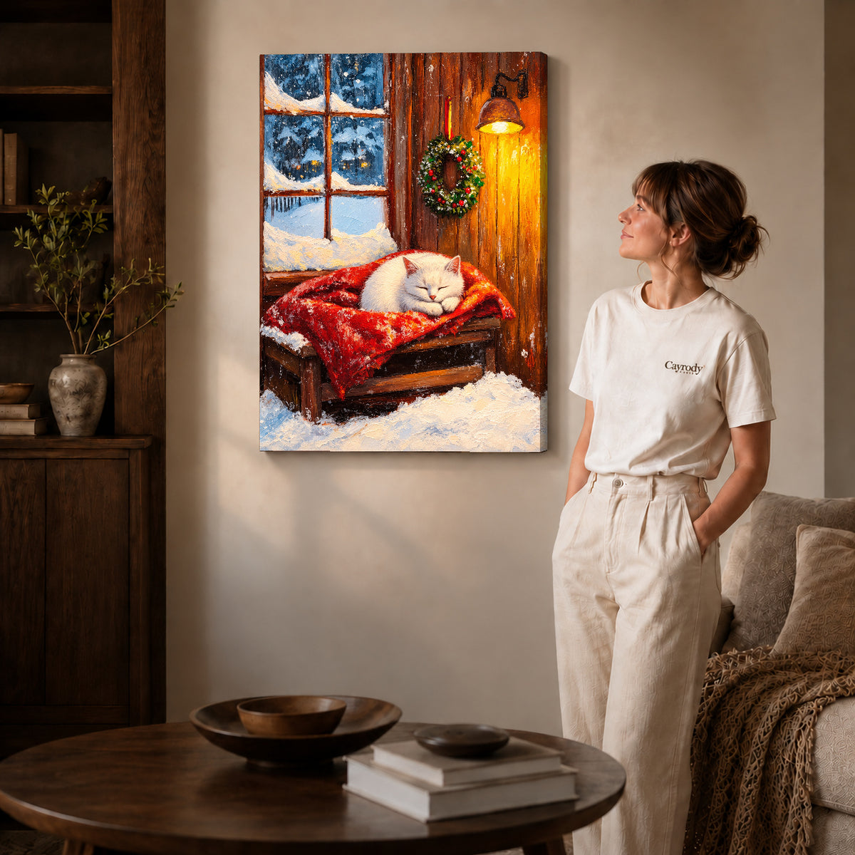 Winter Kitten Canvas Art on gallery wrapped canvas with visible depth beside a woman in white.
