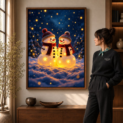 Snowman Canvas Art in a walnut frame beside a standing woman and warm wooden furniture.