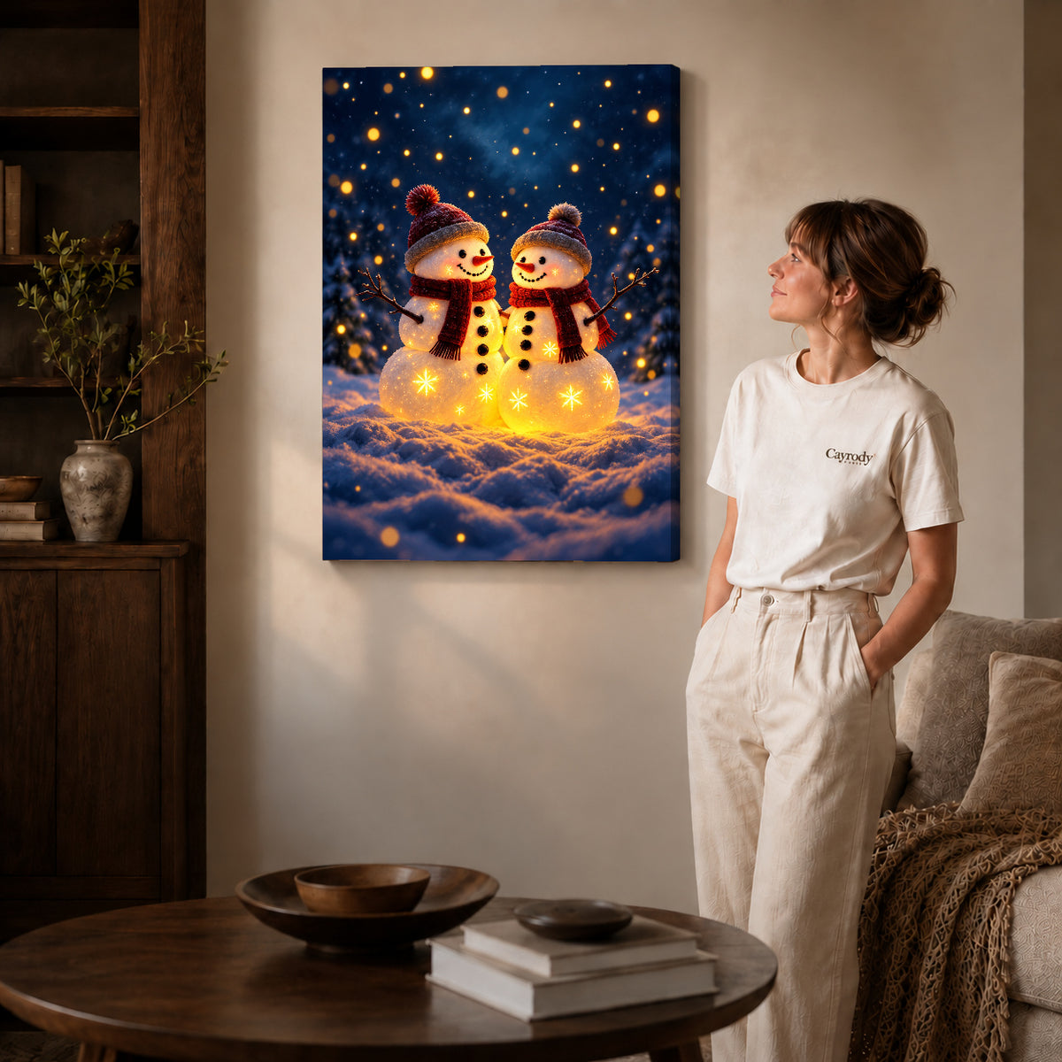Snowman Canvas Art on gallery wrapped canvas with visible depth beside a woman in white.