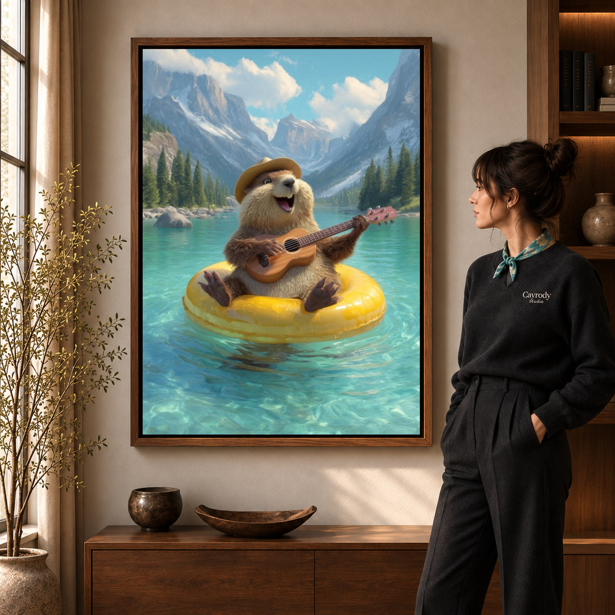 Otter Canvas Art in a walnut frame beside a standing woman and warm wooden furniture.