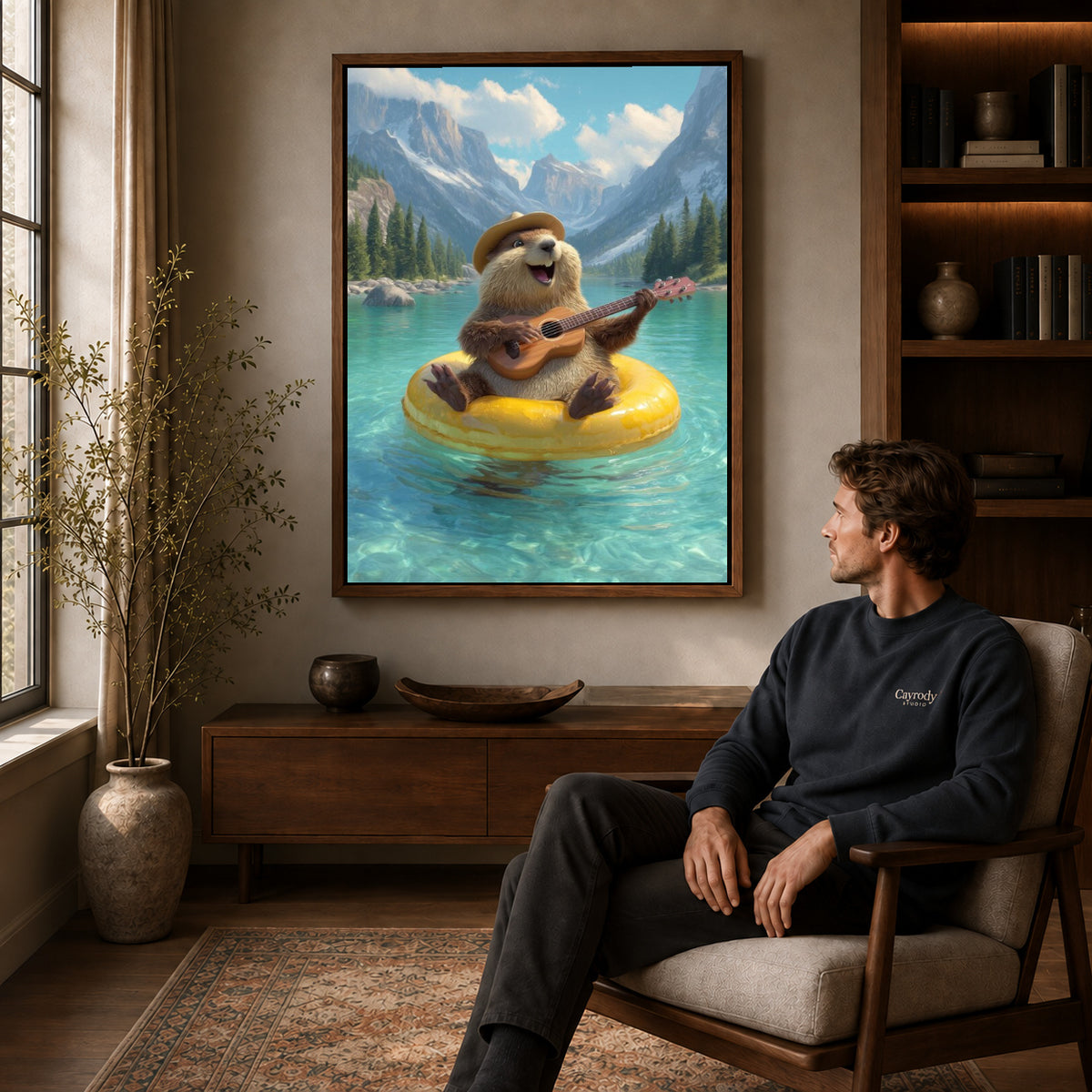 Otter Canvas Art displayed in a walnut frame above wooden furniture beside a seated man.