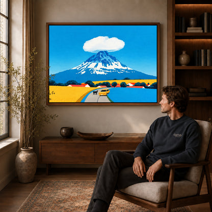 Mount Fuji Canvas Art displayed in a walnut frame above wooden furniture beside a seated man.