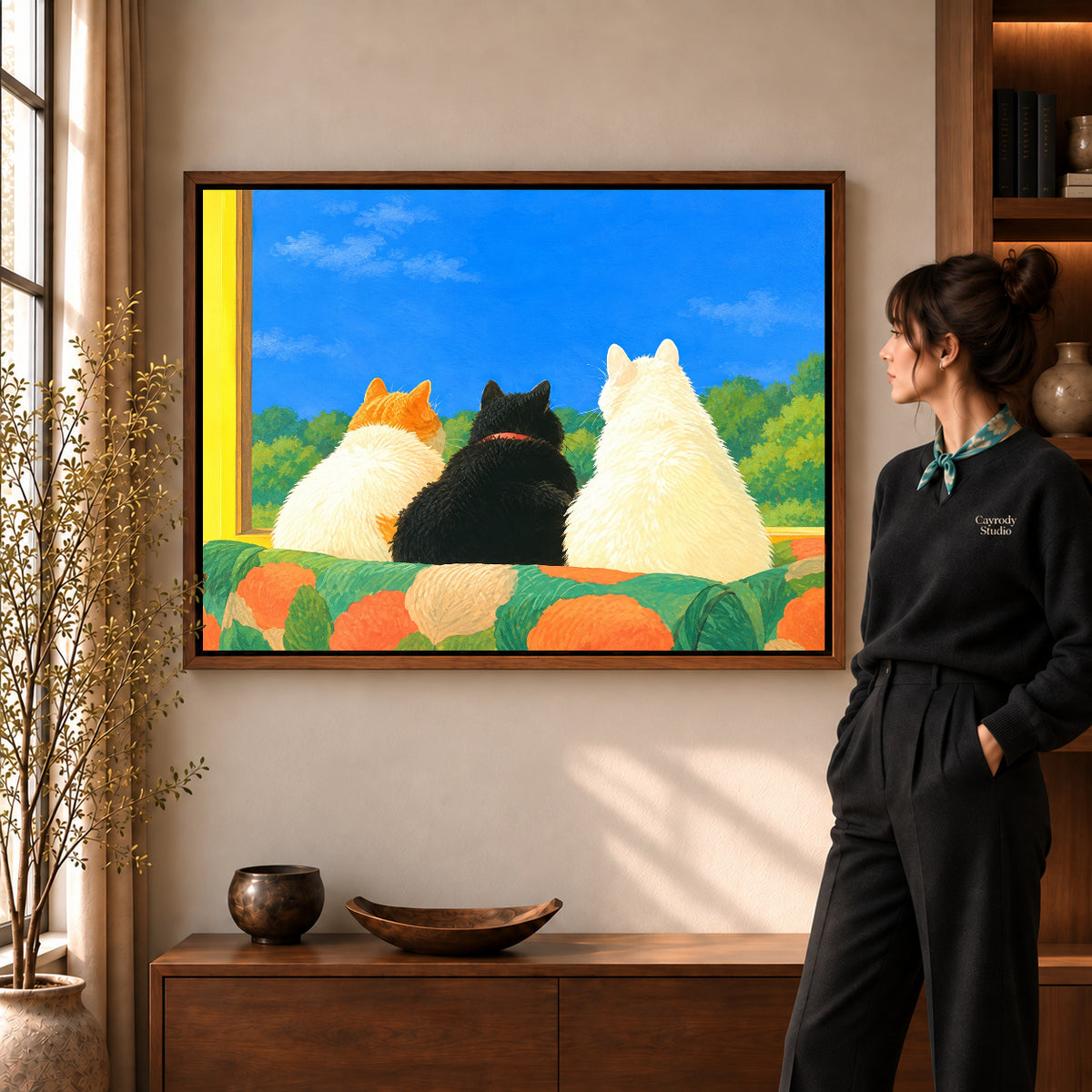 Walnut framed window cats canvas art with the complete artwork displayed in a warm living room.