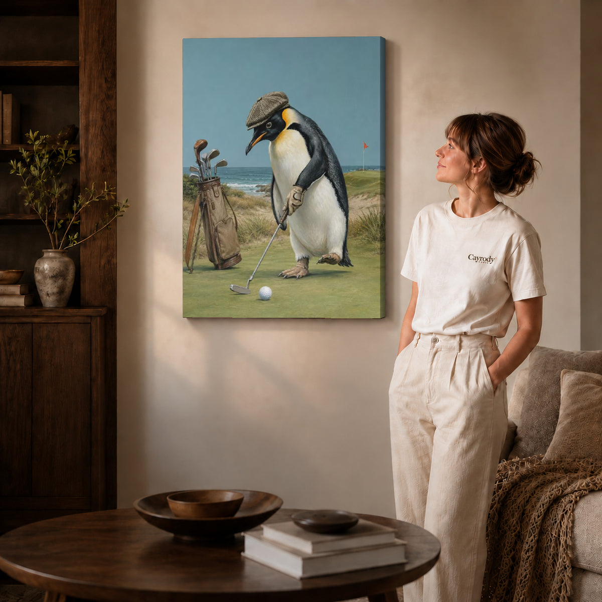 Golf Penguin Canvas Art on gallery wrapped canvas with visible depth beside a woman in white.
