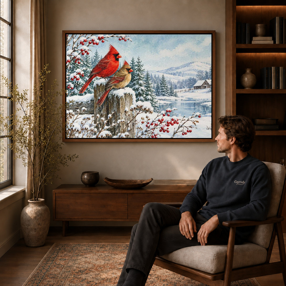 Cardinal Canvas Art displayed in a walnut frame above wooden furniture beside a seated man.