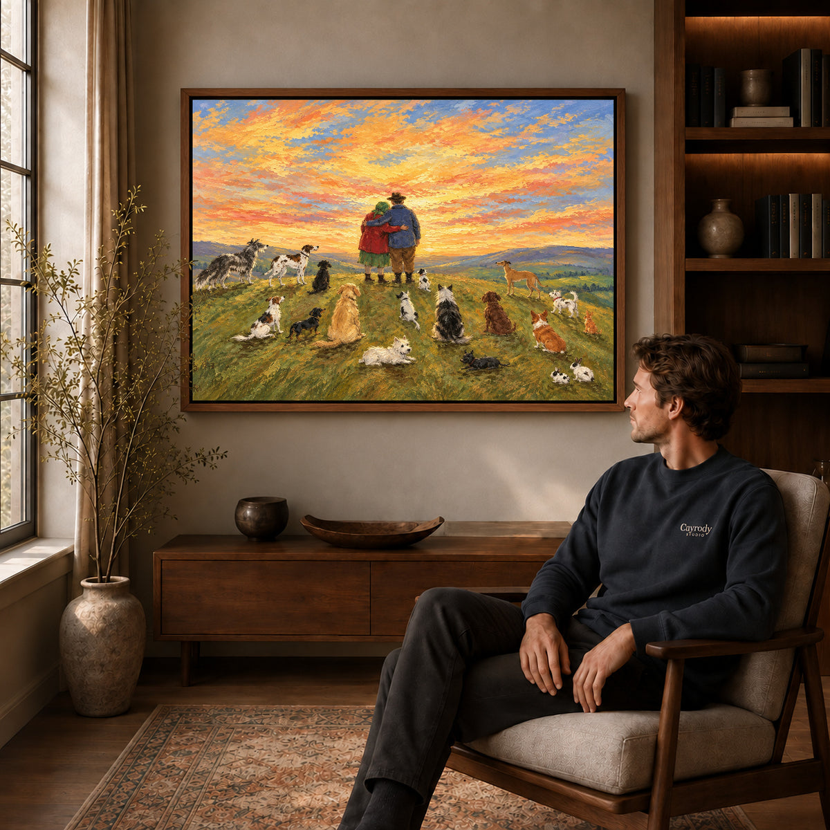 Sunset Companions Canvas Art displayed in a walnut frame above wooden furniture beside a seated man.
