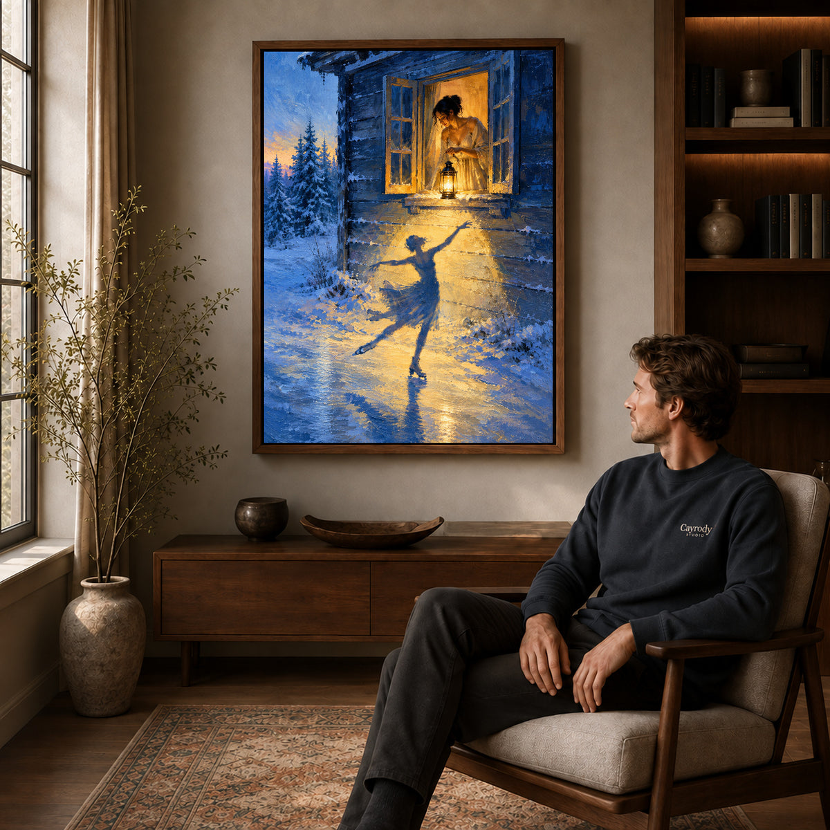 Winter Lantern Canvas Art displayed in a walnut frame above wooden furniture beside a seated man.