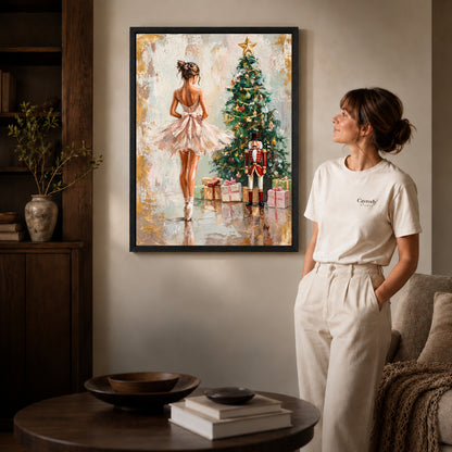 Christmas Ballet Canvas Art inside a black frame in a softly lit living room with books.