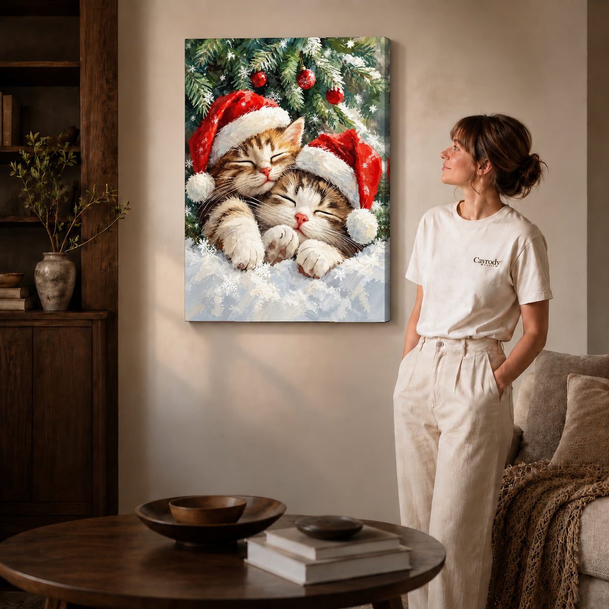 Christmas Kittens Canvas Art on gallery wrapped canvas with visible depth beside a woman in white.