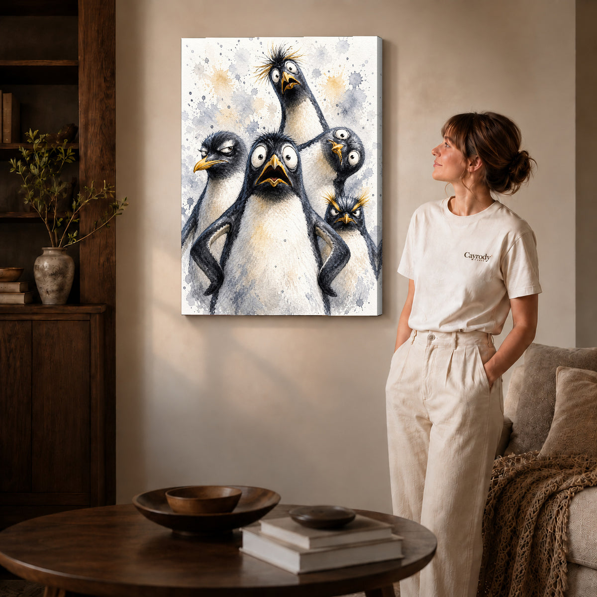 Funny Penguins Canvas Art on gallery wrapped canvas with visible depth beside a woman in white.