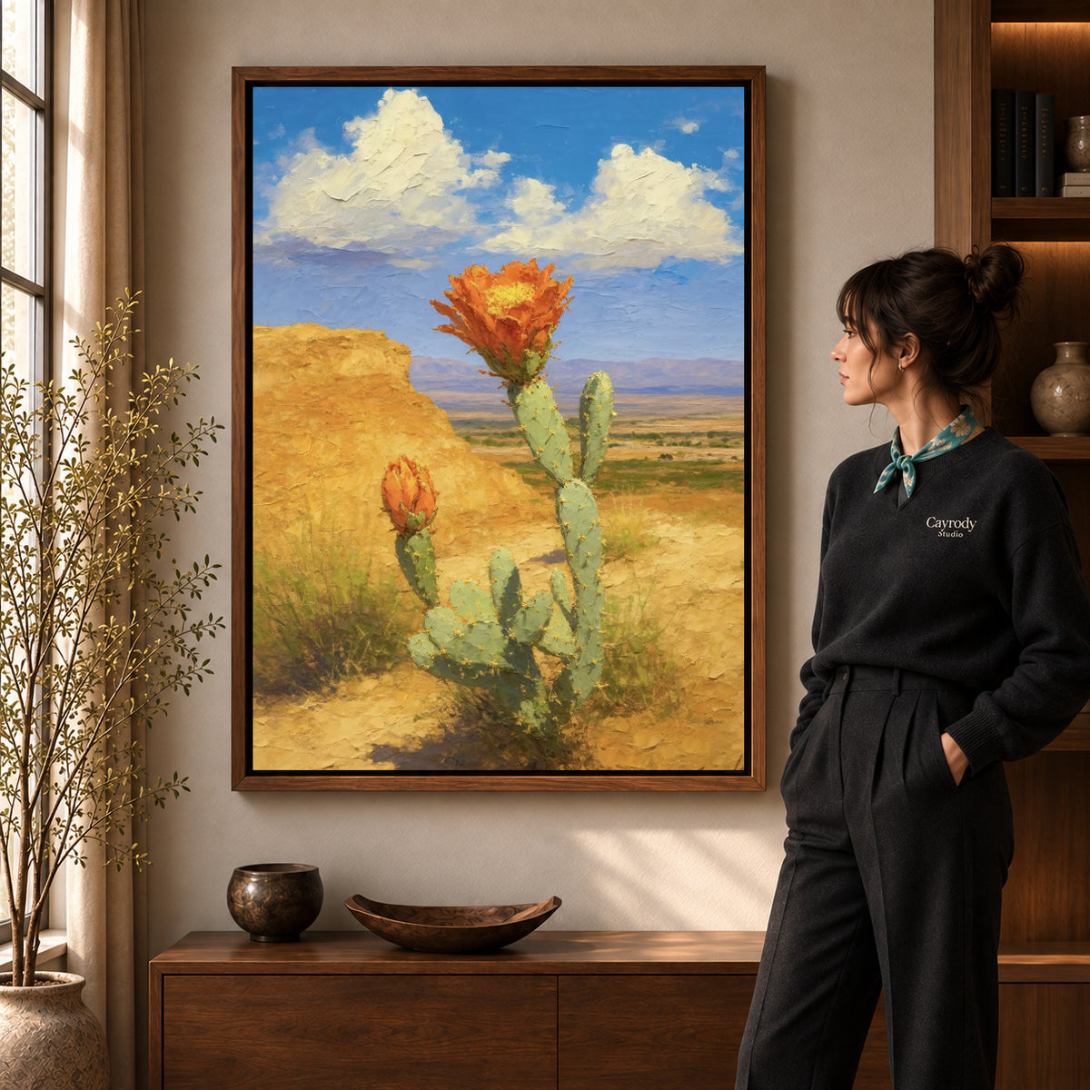 Walnut framed cactus canvas art with the complete artwork displayed in a warm living room.