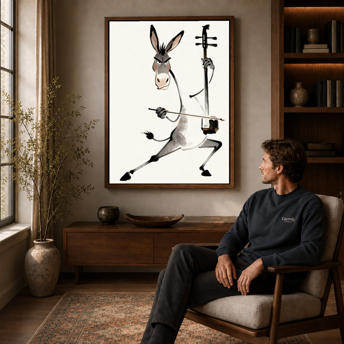 Musical Donkey Canvas Art displayed in a walnut frame above wooden furniture beside a seated man.
