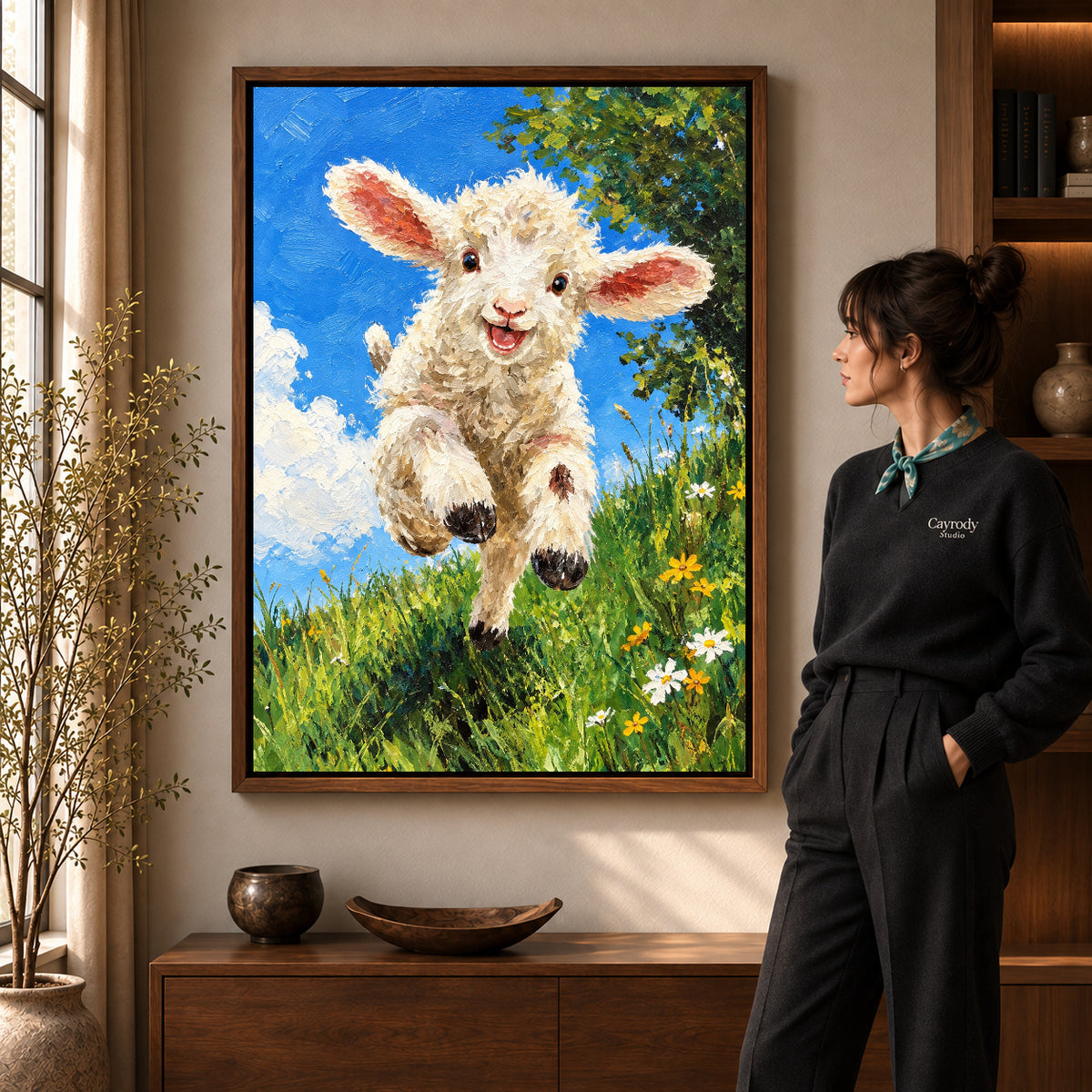 Lamb Canvas Art in a walnut frame beside a standing woman and warm wooden furniture.