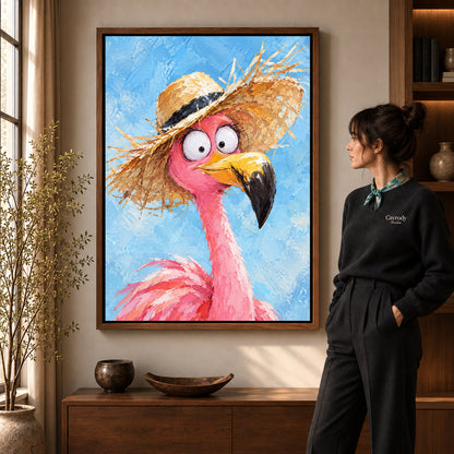 Flamingo Canvas Art in a walnut frame beside a standing woman and warm wooden furniture.
